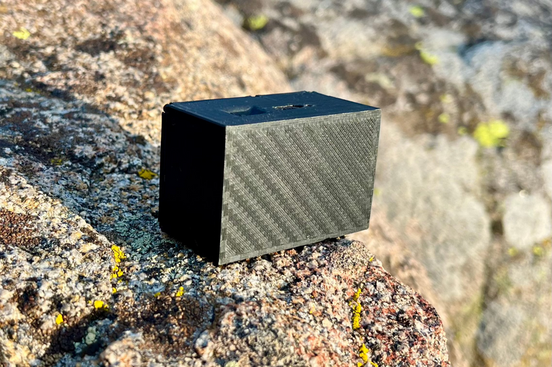 The Mini from behind on a granite boulder, showing the closed rear panel and the depth of the box. 1/24 and 1/18 scale.