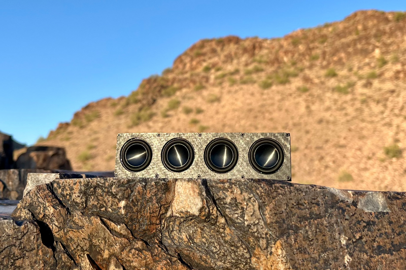 The Quad on desert rock, four 1-inch drivers in a row along a single bar. 1/10 scale RC speaker.