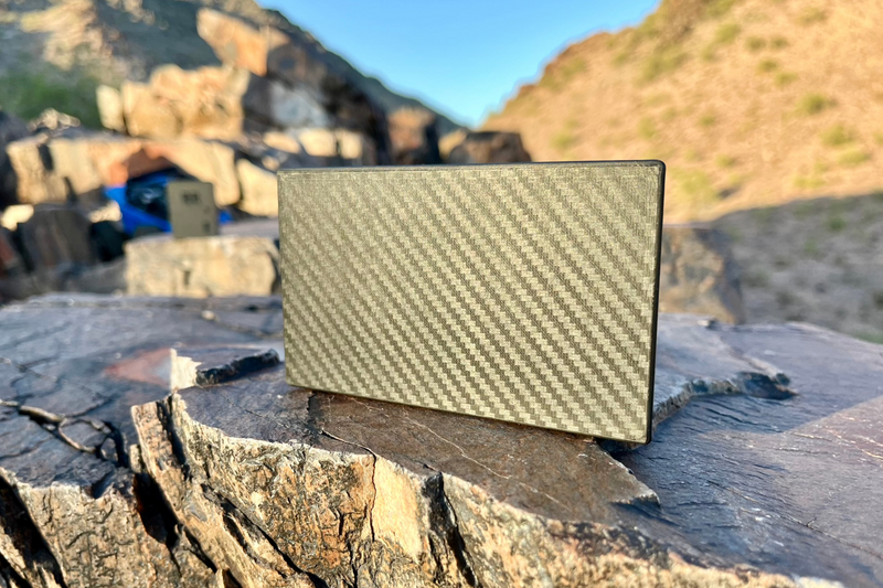 The Overkill turned to face away, showing the plain carbon-look rear panel of the enclosure. 1/10 scale.