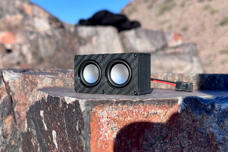The Micro Double resting on a split boulder with its receiver lead running off to the side. 1/24 and 1/18 scale.