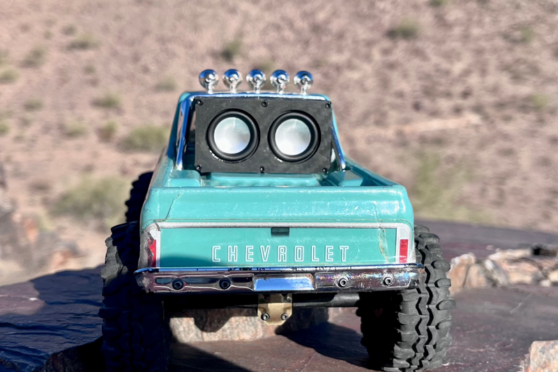 Rear view of a teal Chevrolet-bodied RC crawler with The Micro Double mounted on the cab roof. 1/24 and 1/18 scale.